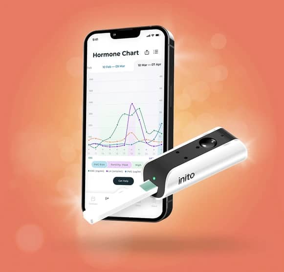 Fertility monitor device shown on phone
